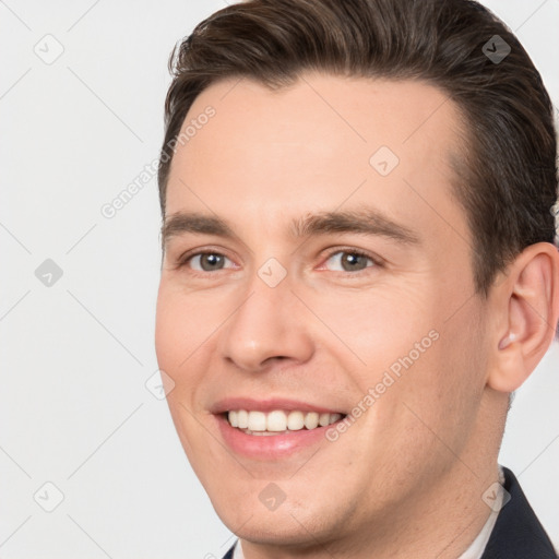 Joyful white young-adult male with short  brown hair and brown eyes