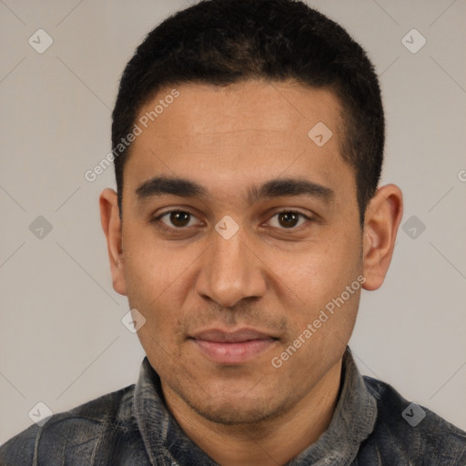 Joyful white young-adult male with short  black hair and brown eyes