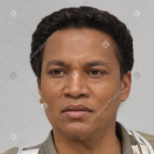 Neutral latino adult male with short  brown hair and brown eyes