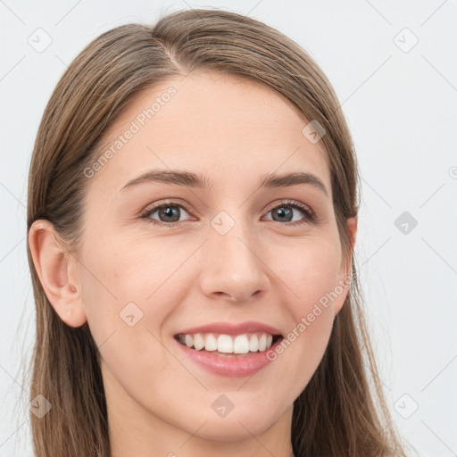 Joyful white young-adult female with long  brown hair and blue eyes