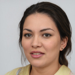 Joyful white young-adult female with medium  brown hair and brown eyes