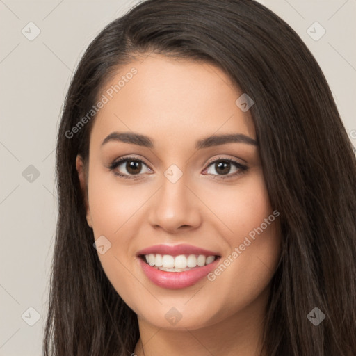 Joyful white young-adult female with long  black hair and brown eyes