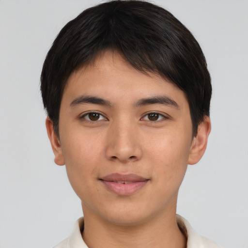 Joyful asian young-adult male with short  brown hair and brown eyes