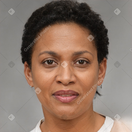 Joyful black adult female with short  brown hair and brown eyes