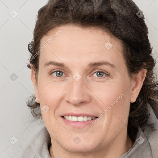 Joyful white adult female with short  brown hair and brown eyes