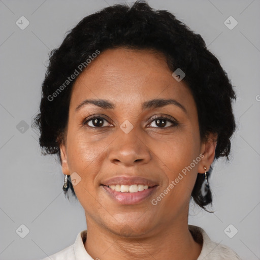 Joyful black adult female with short  brown hair and brown eyes