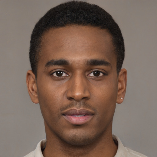 Neutral black young-adult male with short  brown hair and brown eyes