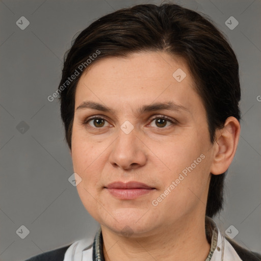 Joyful white adult female with medium  brown hair and brown eyes