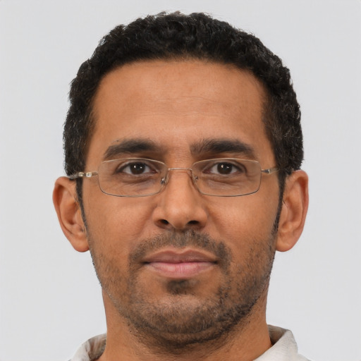 Neutral black adult male with short  black hair and brown eyes