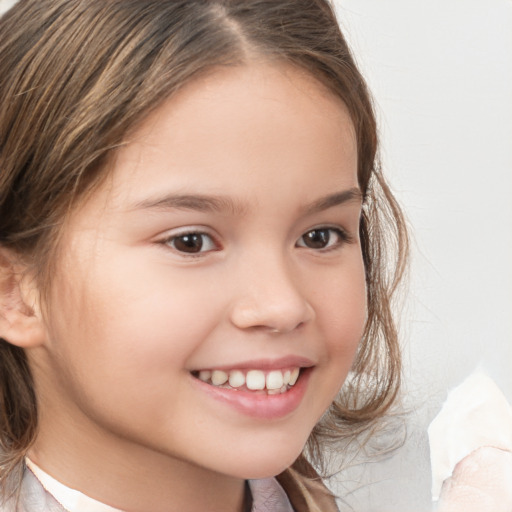 Joyful white child female with medium  brown hair and brown eyes