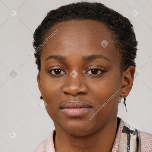 Joyful black young-adult female with short  brown hair and brown eyes