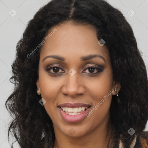 Joyful black young-adult female with long  brown hair and brown eyes