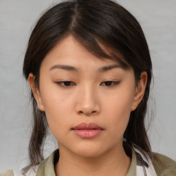 Neutral asian young-adult female with medium  brown hair and brown eyes