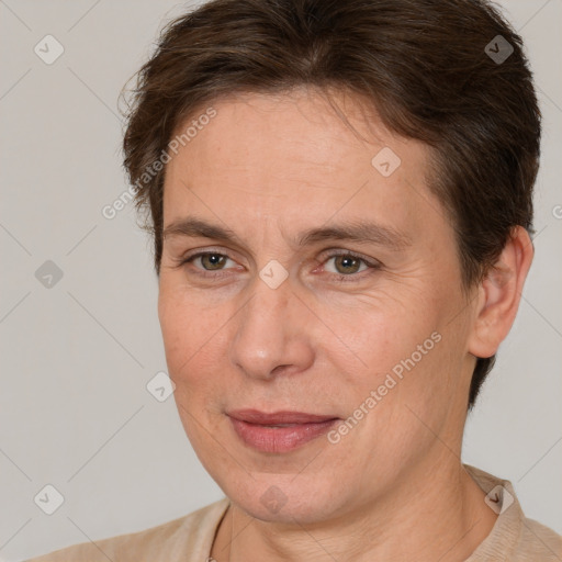 Joyful white adult female with short  brown hair and brown eyes