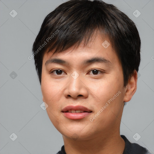 Joyful asian young-adult male with short  black hair and brown eyes