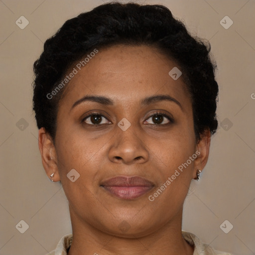 Joyful latino adult female with short  brown hair and brown eyes