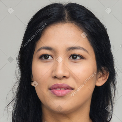 Joyful latino young-adult female with long  black hair and brown eyes