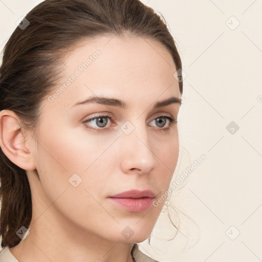 Neutral white young-adult female with medium  brown hair and grey eyes