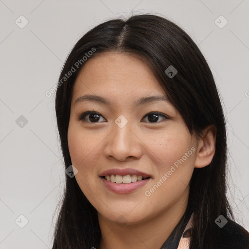 Joyful asian young-adult female with long  brown hair and brown eyes