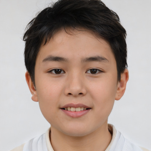 Joyful white child male with short  brown hair and brown eyes