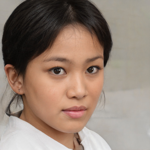 Neutral asian young-adult female with medium  brown hair and brown eyes