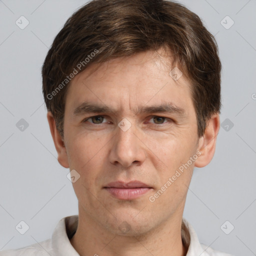 Joyful white adult male with short  brown hair and grey eyes