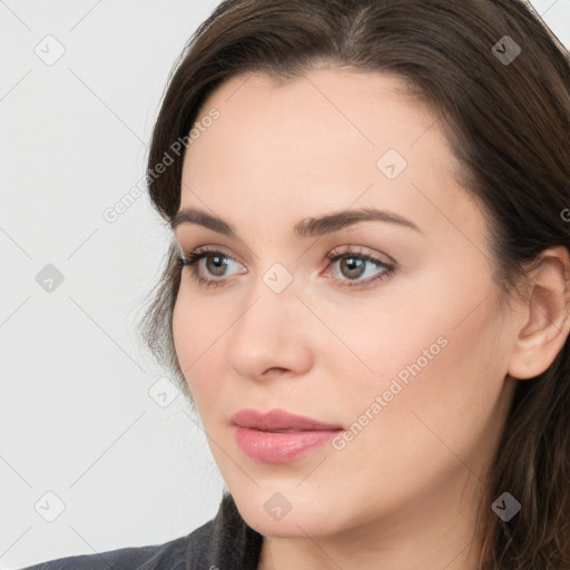 Neutral white young-adult female with long  brown hair and brown eyes