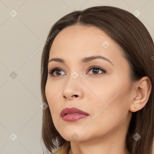 Neutral white young-adult female with long  brown hair and brown eyes