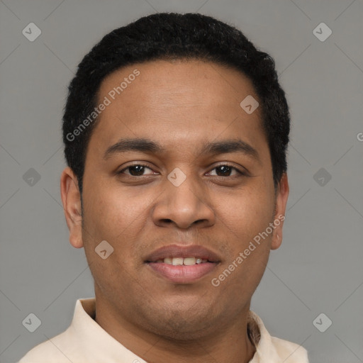 Joyful latino young-adult male with short  black hair and brown eyes