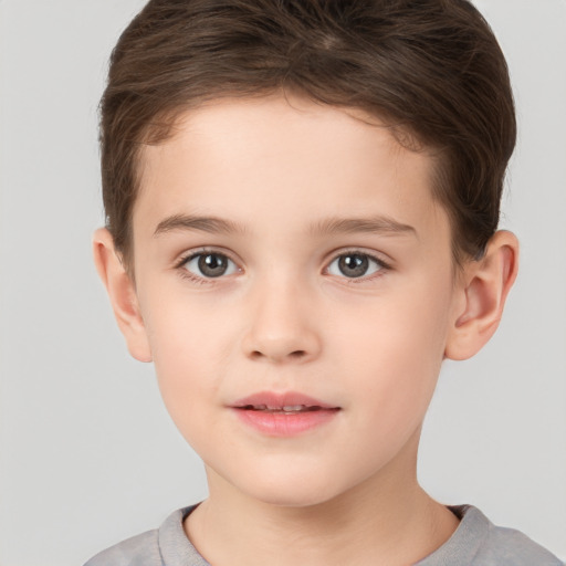 Joyful white child male with short  brown hair and brown eyes