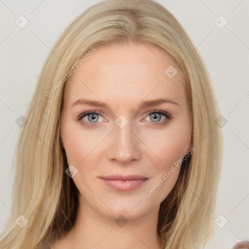 Joyful white young-adult female with long  brown hair and blue eyes