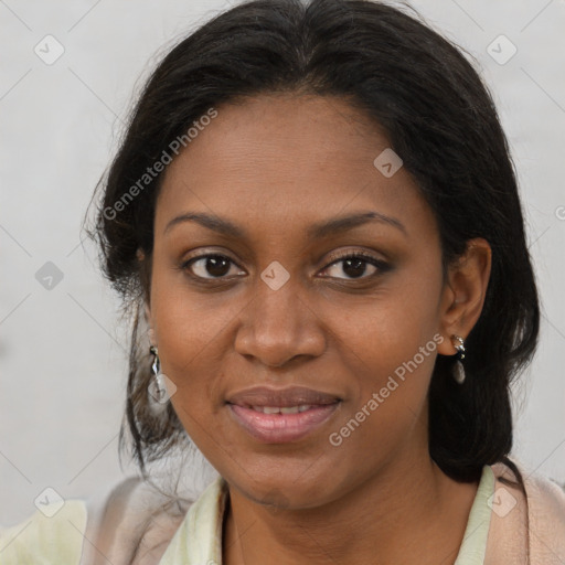 Joyful black young-adult female with medium  brown hair and brown eyes