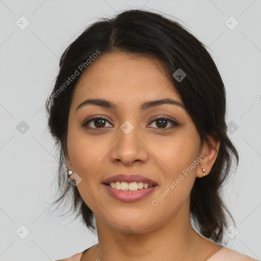 Joyful latino young-adult female with medium  brown hair and brown eyes