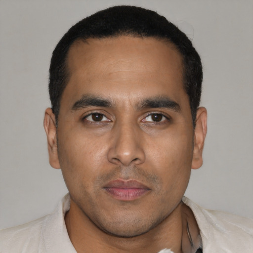 Neutral latino young-adult male with short  black hair and brown eyes