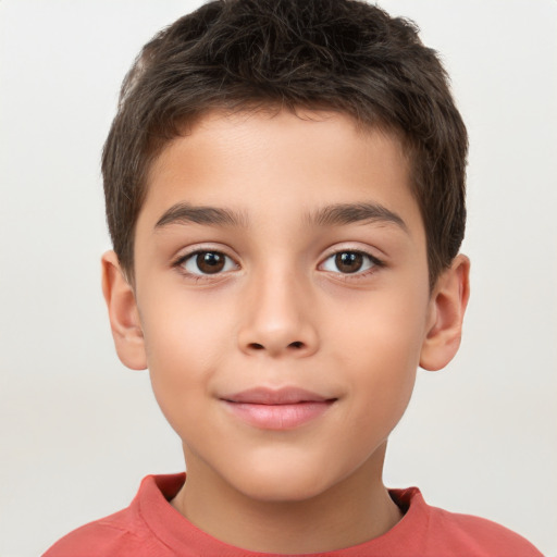 Joyful white child male with short  brown hair and brown eyes