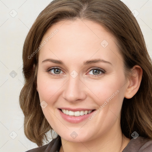 Joyful white young-adult female with medium  brown hair and blue eyes