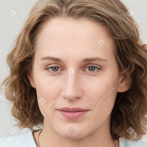 Joyful white young-adult female with medium  brown hair and blue eyes