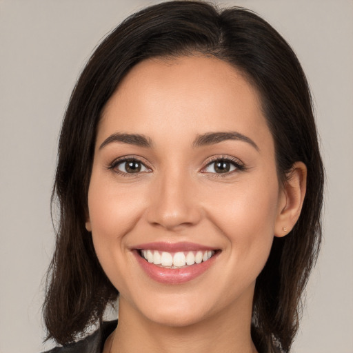 Joyful white young-adult female with medium  brown hair and brown eyes