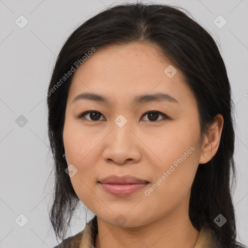 Joyful asian young-adult female with long  brown hair and brown eyes