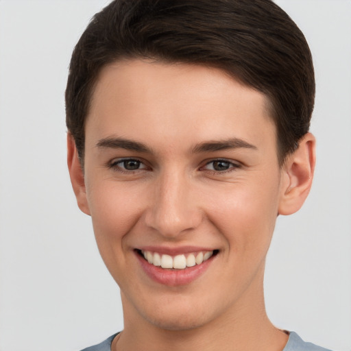 Joyful white young-adult female with short  brown hair and brown eyes