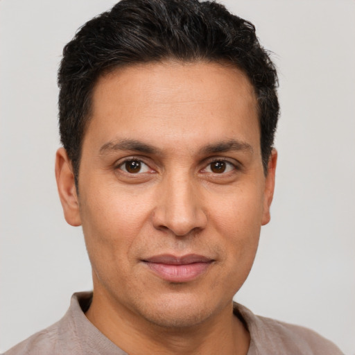 Joyful white adult male with short  brown hair and brown eyes