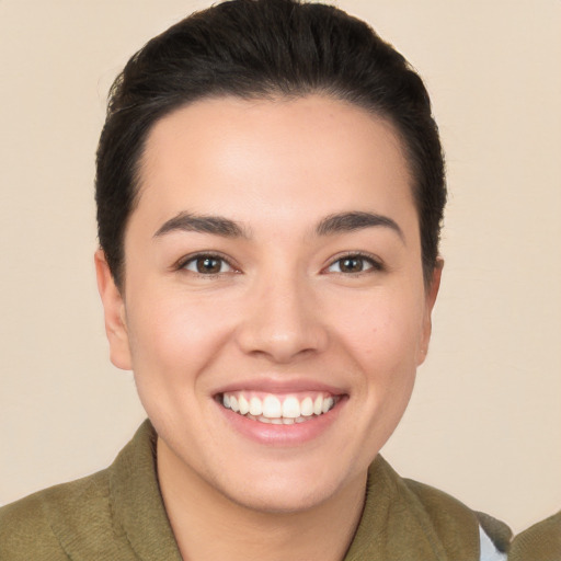 Joyful white young-adult female with short  brown hair and brown eyes