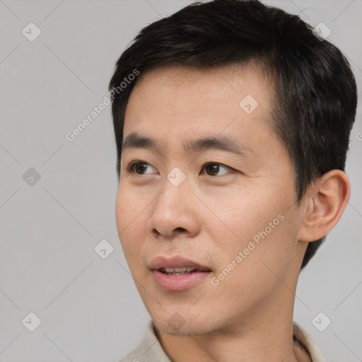 Neutral asian young-adult male with short  black hair and brown eyes