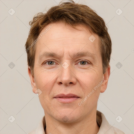 Joyful white adult male with short  brown hair and grey eyes