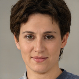 Joyful white adult female with short  brown hair and brown eyes