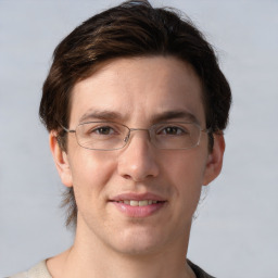 Joyful white adult male with short  brown hair and grey eyes