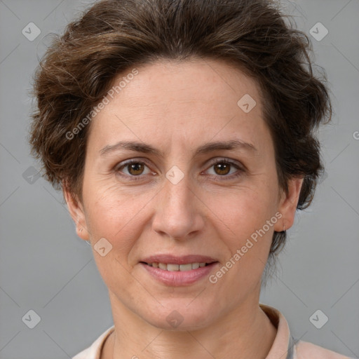 Joyful white adult female with short  brown hair and brown eyes