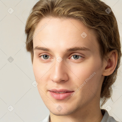 Joyful white young-adult female with short  brown hair and grey eyes