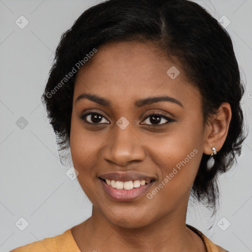 Joyful black young-adult female with long  black hair and brown eyes