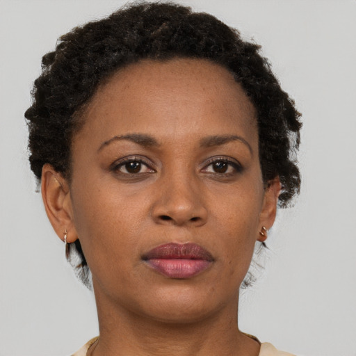 Neutral black adult female with short  brown hair and brown eyes